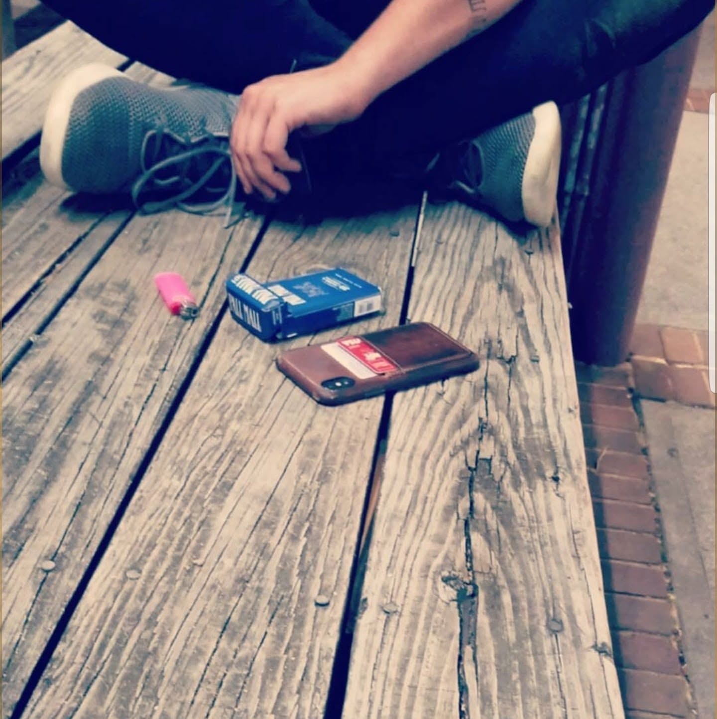 The author sitting on a weathered wooden porch